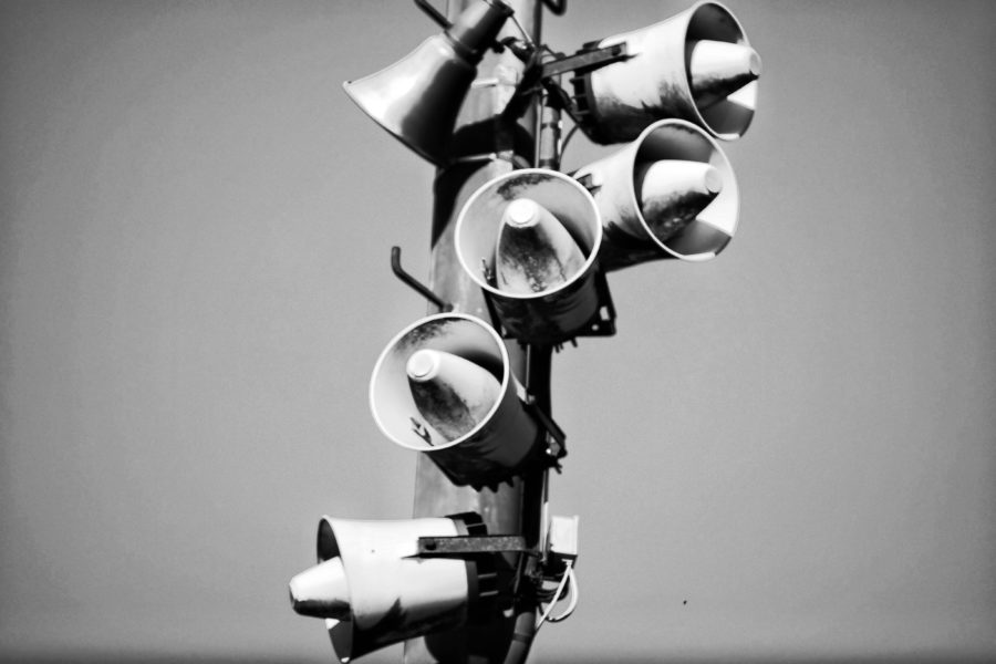 megaphones on a pole creating noise